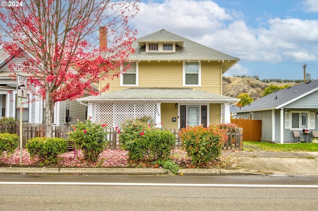 front of property featuring a porch and a mountain view