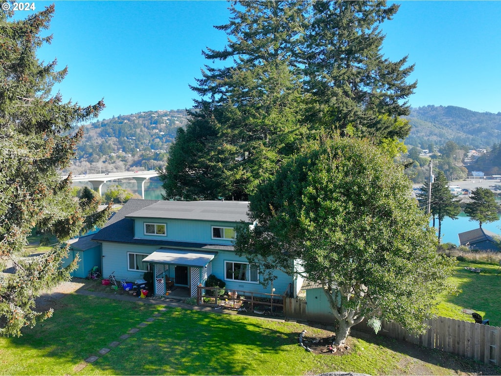 exterior space with a mountain view and a yard