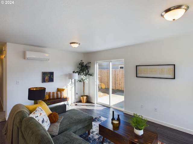 living room with a wall mounted AC and wood-type flooring