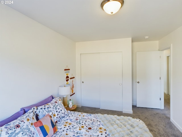 carpeted bedroom with a closet