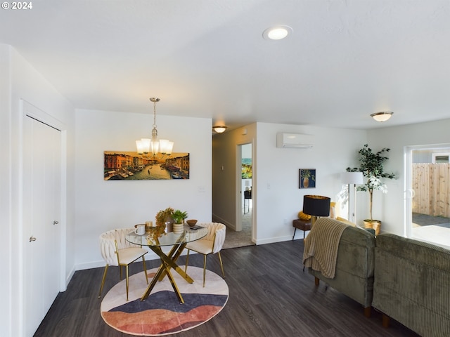 dining room featuring an inviting chandelier, dark hardwood / wood-style floors, and an AC wall unit