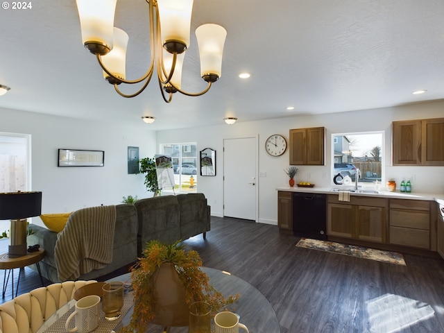 living room with sink, dark hardwood / wood-style floors, and a notable chandelier