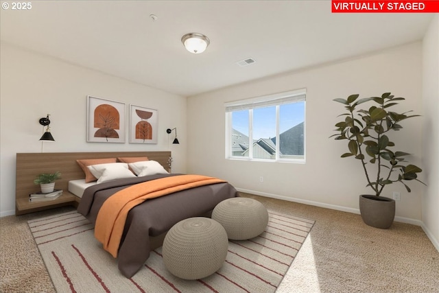 bedroom with carpet, visible vents, and baseboards