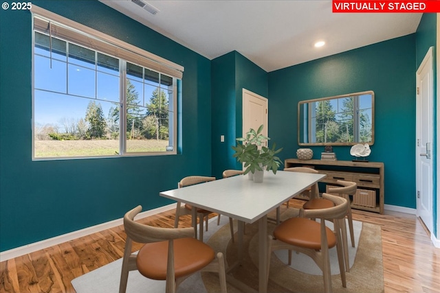 dining room featuring light wood finished floors, recessed lighting, visible vents, and baseboards