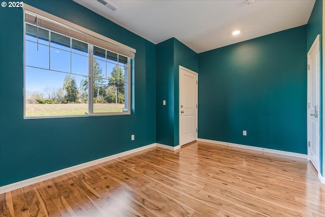 unfurnished bedroom featuring recessed lighting, baseboards, visible vents, and light wood finished floors