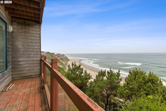 balcony with a view of the beach and a water view