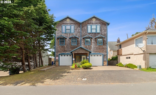 view of front of house featuring an attached garage and driveway