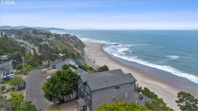 birds eye view of property featuring a view of the beach and a water view