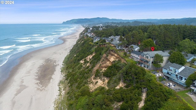 bird's eye view with a water view and a view of the beach