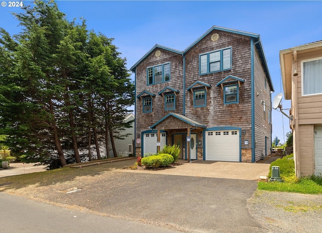 view of front of property with a garage and driveway