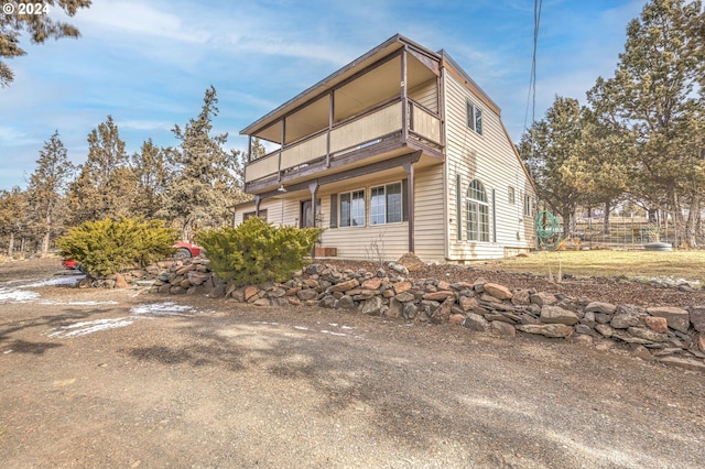 view of home's exterior featuring a balcony