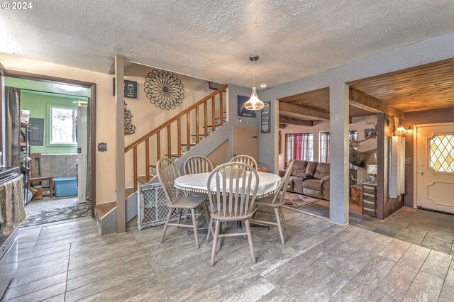 dining area with a textured ceiling