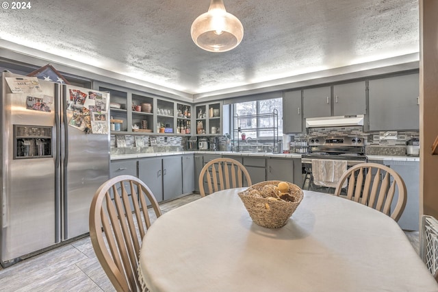 dining area featuring a textured ceiling