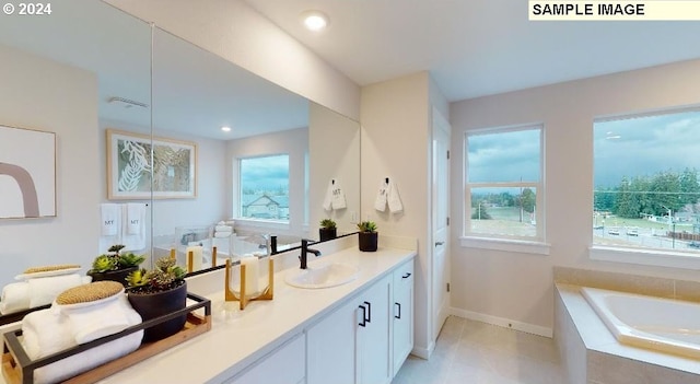 bathroom featuring vanity, tiled bath, and tile patterned floors