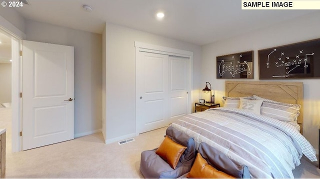 bedroom with a closet and light colored carpet