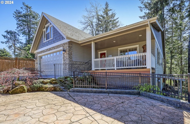 view of front of home featuring a garage and covered porch