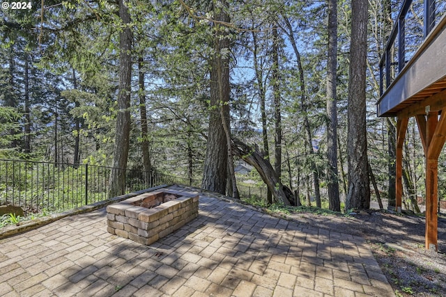 view of patio / terrace with a fire pit