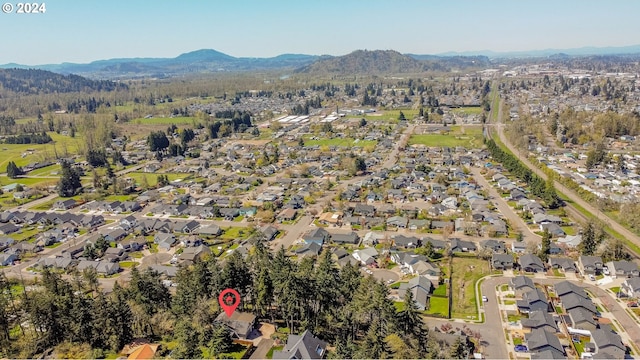 birds eye view of property featuring a mountain view