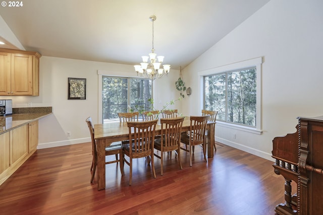 dining area featuring vaulted ceiling, dark hardwood / wood-style flooring, and a chandelier