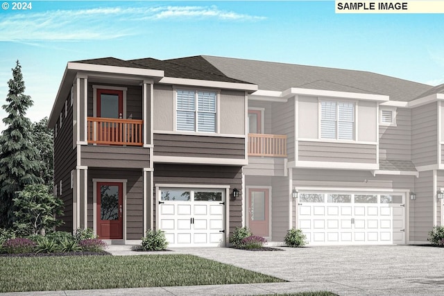 townhome / multi-family property with a garage and a balcony