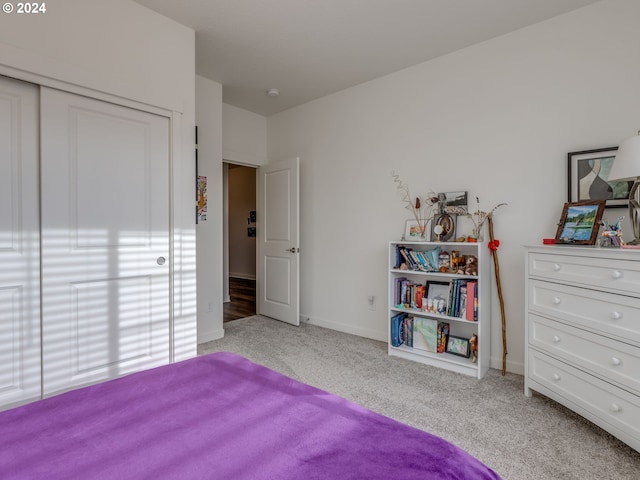 carpeted bedroom featuring a closet