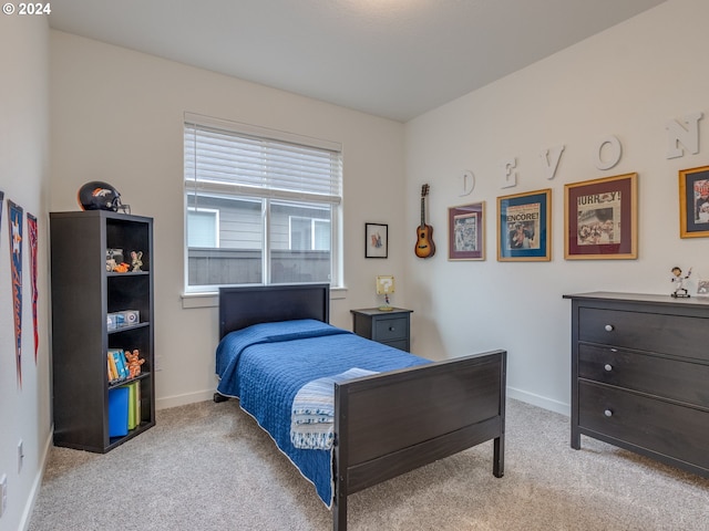 bedroom with light colored carpet