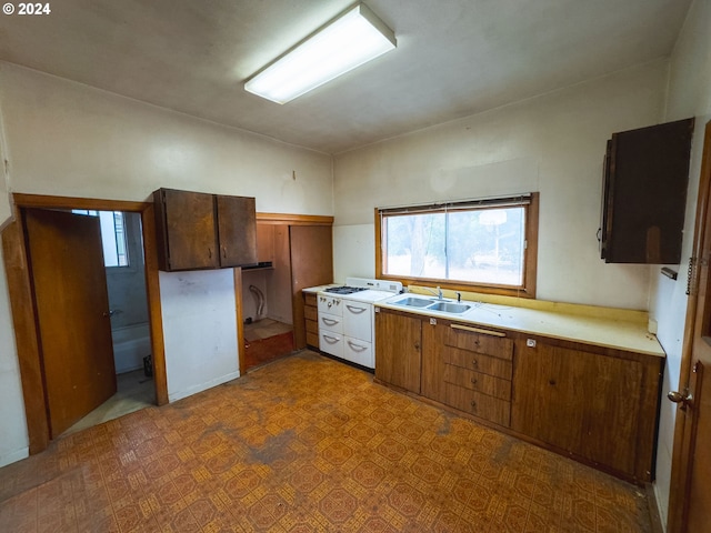 kitchen with sink and white range