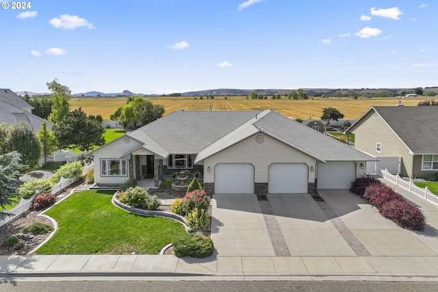 view of front facade featuring a front yard and a garage