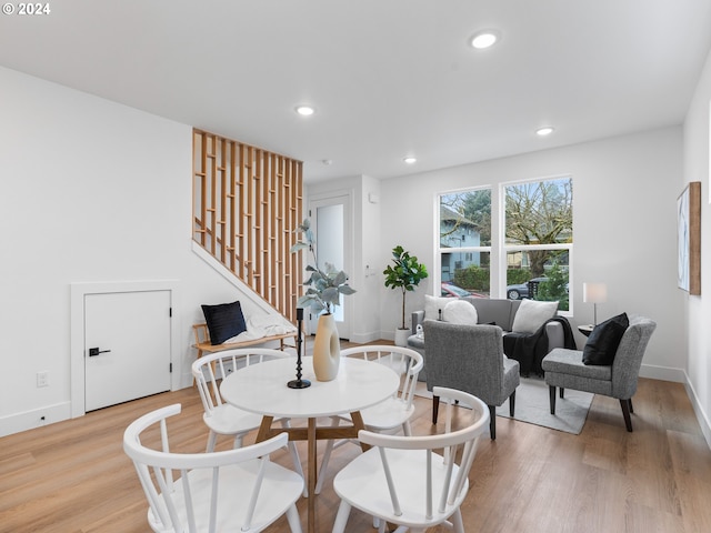 dining space featuring light wood-type flooring