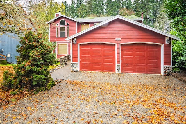 garage featuring driveway