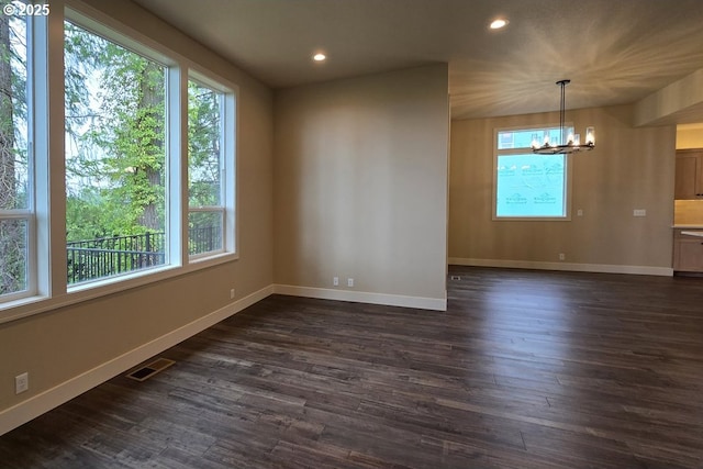 3404 River Heights Dr, Springfield, OR 97477 - spare room with a chandelier, recessed lighting, baseboards, and dark wood finished floors