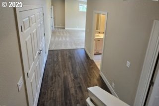 3404 River Heights Dr, Springfield, OR 97477 - corridor featuring dark wood-type flooring and baseboards