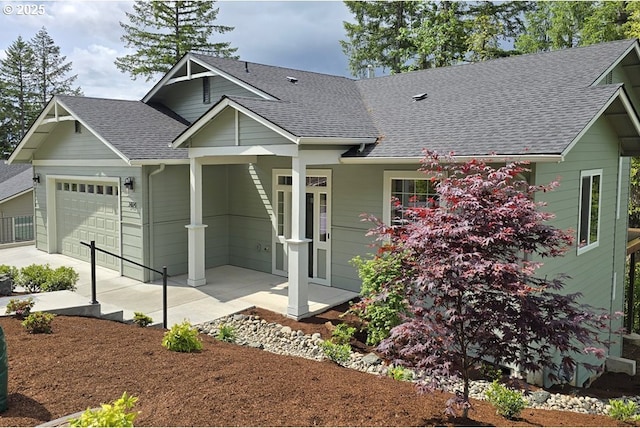 3404 River Heights Dr, Springfield, OR 97477 - view of front of home featuring a shingled roof, an attached garage, and covered porch