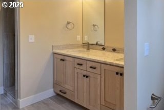 3404 River Heights Dr, Springfield, OR 97477 - bathroom with double vanity and baseboards