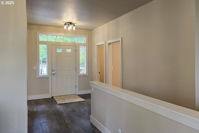 3404 River Heights Dr, Springfield, OR 97477 - foyer entrance with dark wood-type flooring, baseboards, and a chandelier