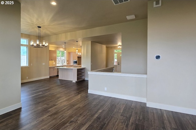 3404 River Heights Dr, Springfield, OR 97477 - unfurnished living room with baseboards, a chandelier, dark wood finished floors, healthy amount of natural light, and recessed lighting