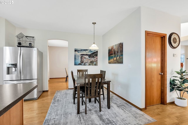 dining area featuring light wood-type flooring