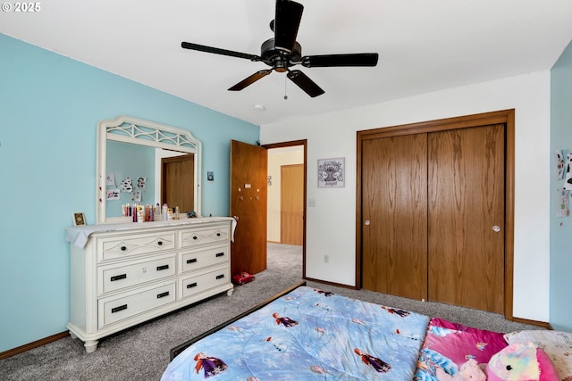 carpeted bedroom featuring ceiling fan and a closet