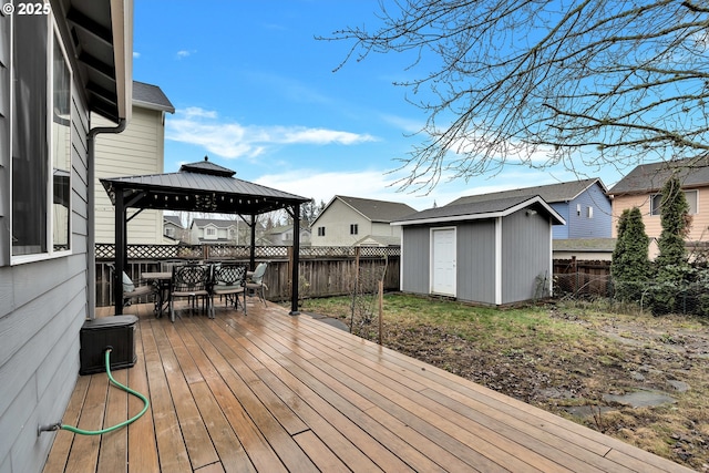 deck featuring a gazebo and a shed