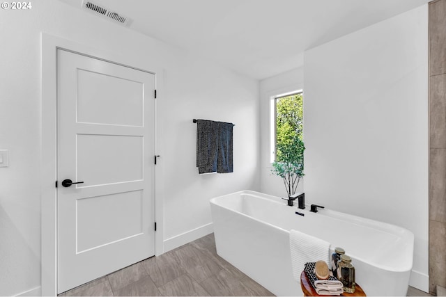 bathroom featuring a tub