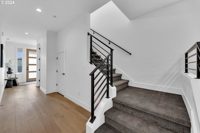 staircase featuring hardwood / wood-style floors