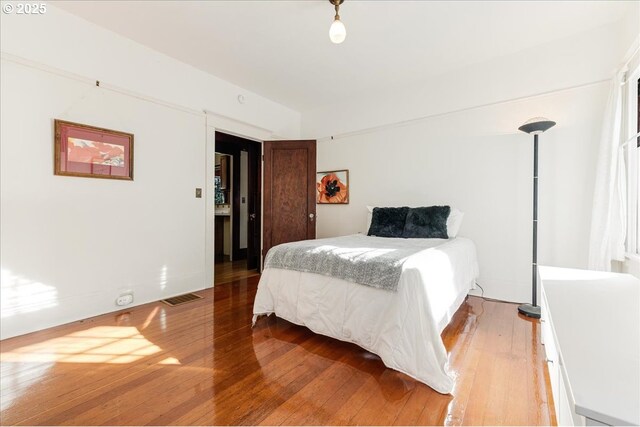 bedroom featuring wood-type flooring