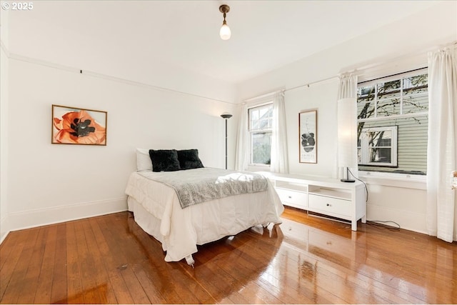 bedroom with hardwood / wood-style floors