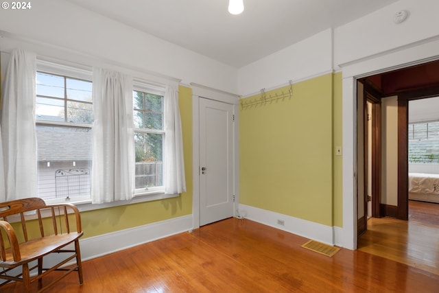 sitting room with hardwood / wood-style flooring