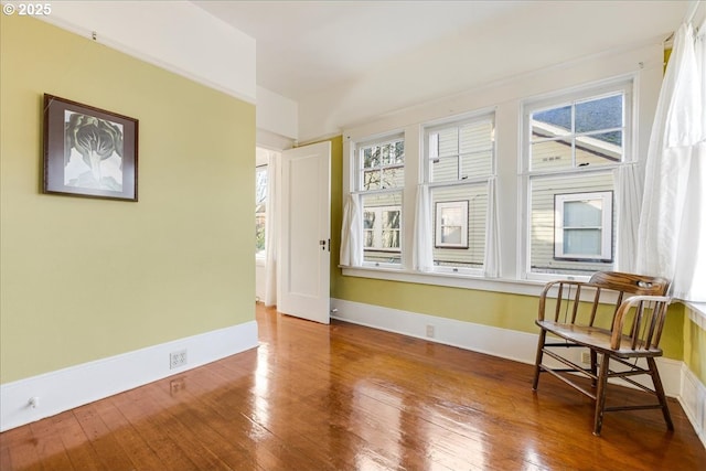 unfurnished room with wood-type flooring