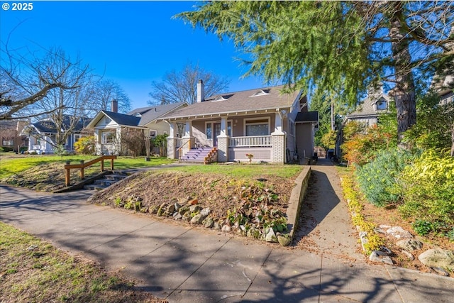 view of front of house featuring a front lawn and a porch