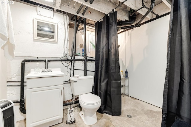 bathroom with concrete floors, vanity, and toilet