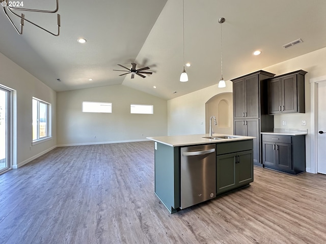 kitchen featuring sink, decorative light fixtures, stainless steel dishwasher, a kitchen island with sink, and light hardwood / wood-style floors