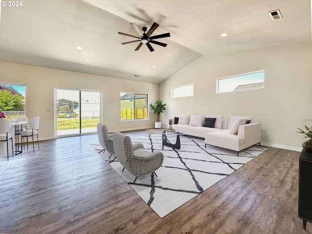 living room featuring ceiling fan, lofted ceiling, and light wood-type flooring