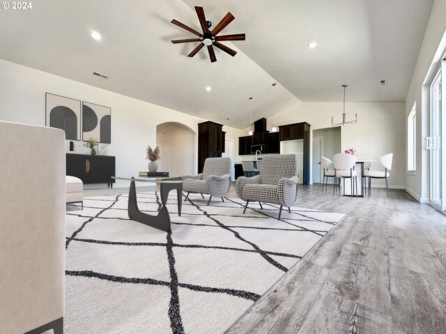 living room with lofted ceiling and light hardwood / wood-style floors